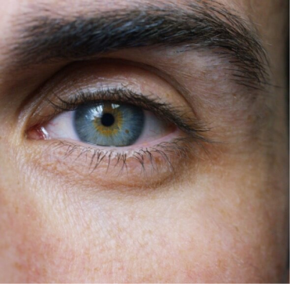 Close up of a man's blue eye