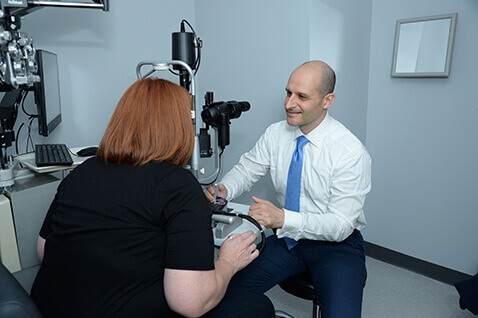 Dr. James Kirszrot with patient